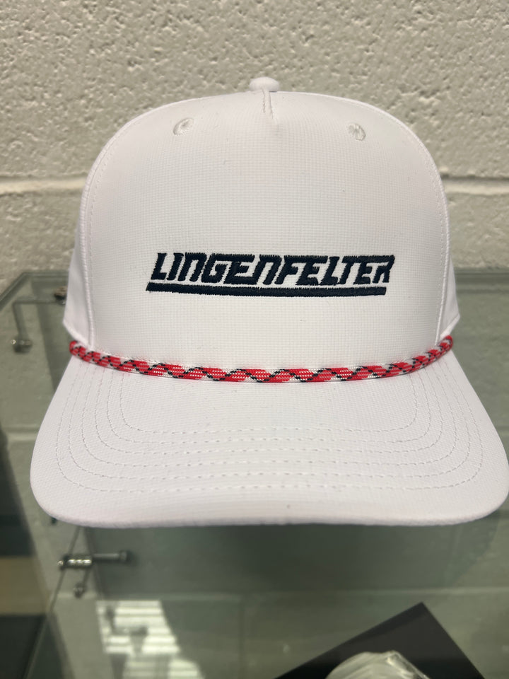 White cap with red brim and 'Lingenfelter' branding on a textured wall.
