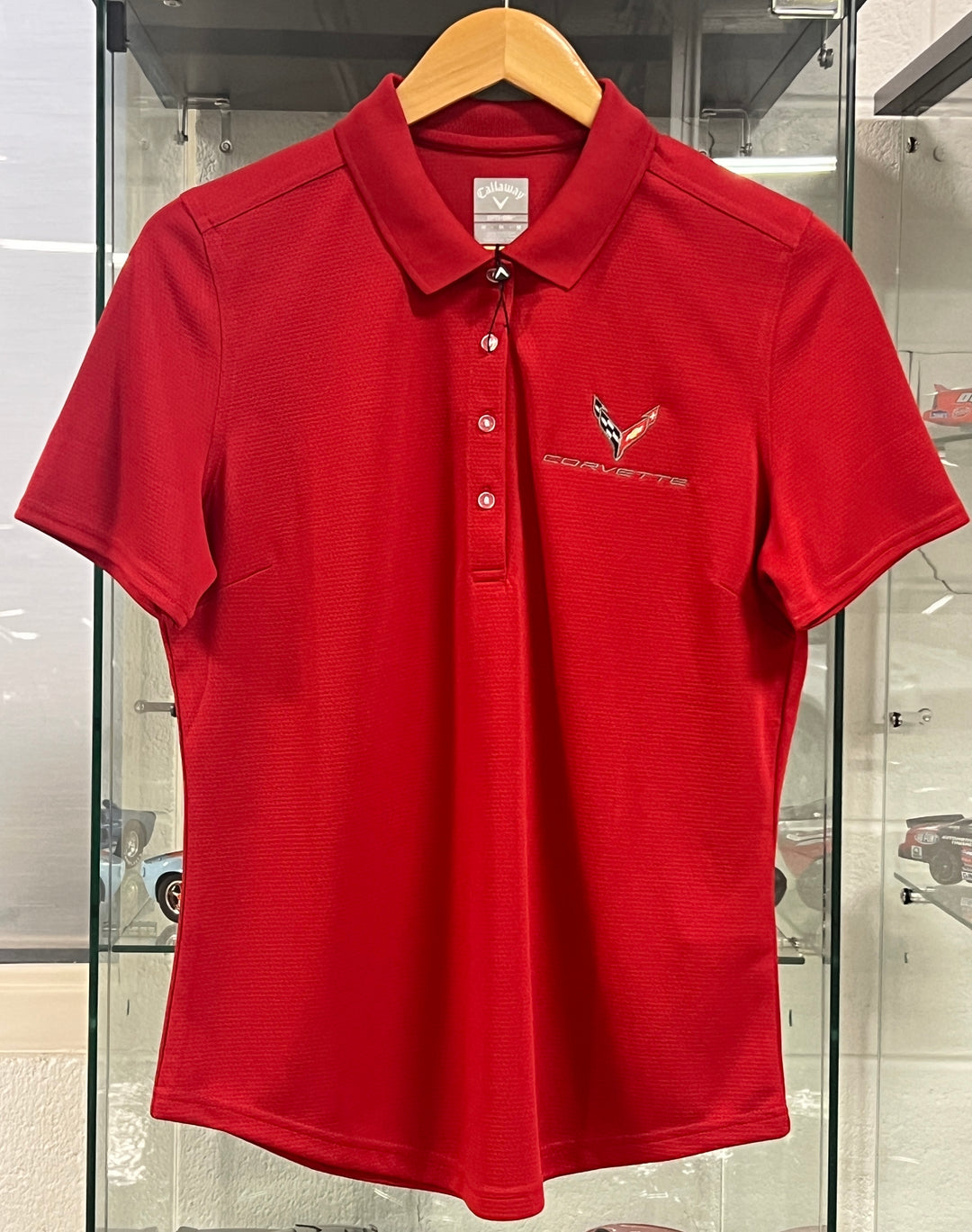 Red women's polo shirt with C8 Corvette logo, performance fit, by Lingenfelter Race Gear, designed for sporty, stylish women.