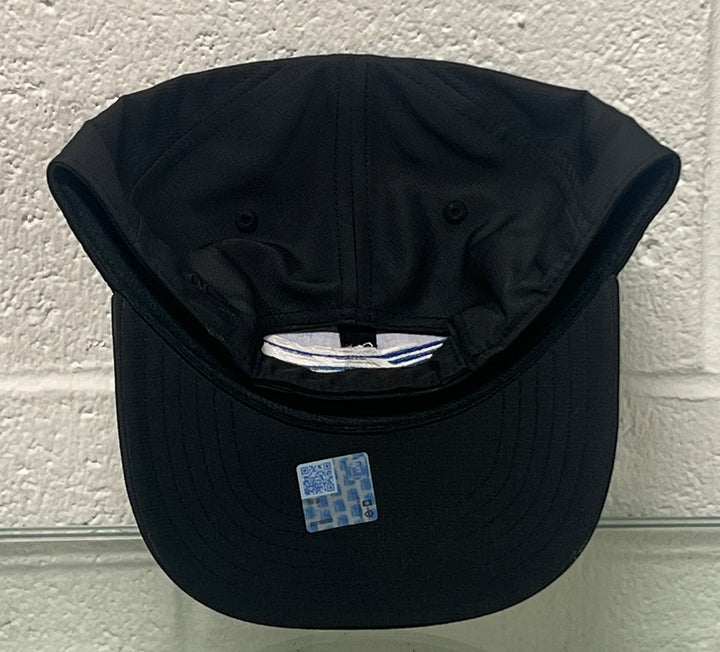Black cap with a brand label on a textured white background
