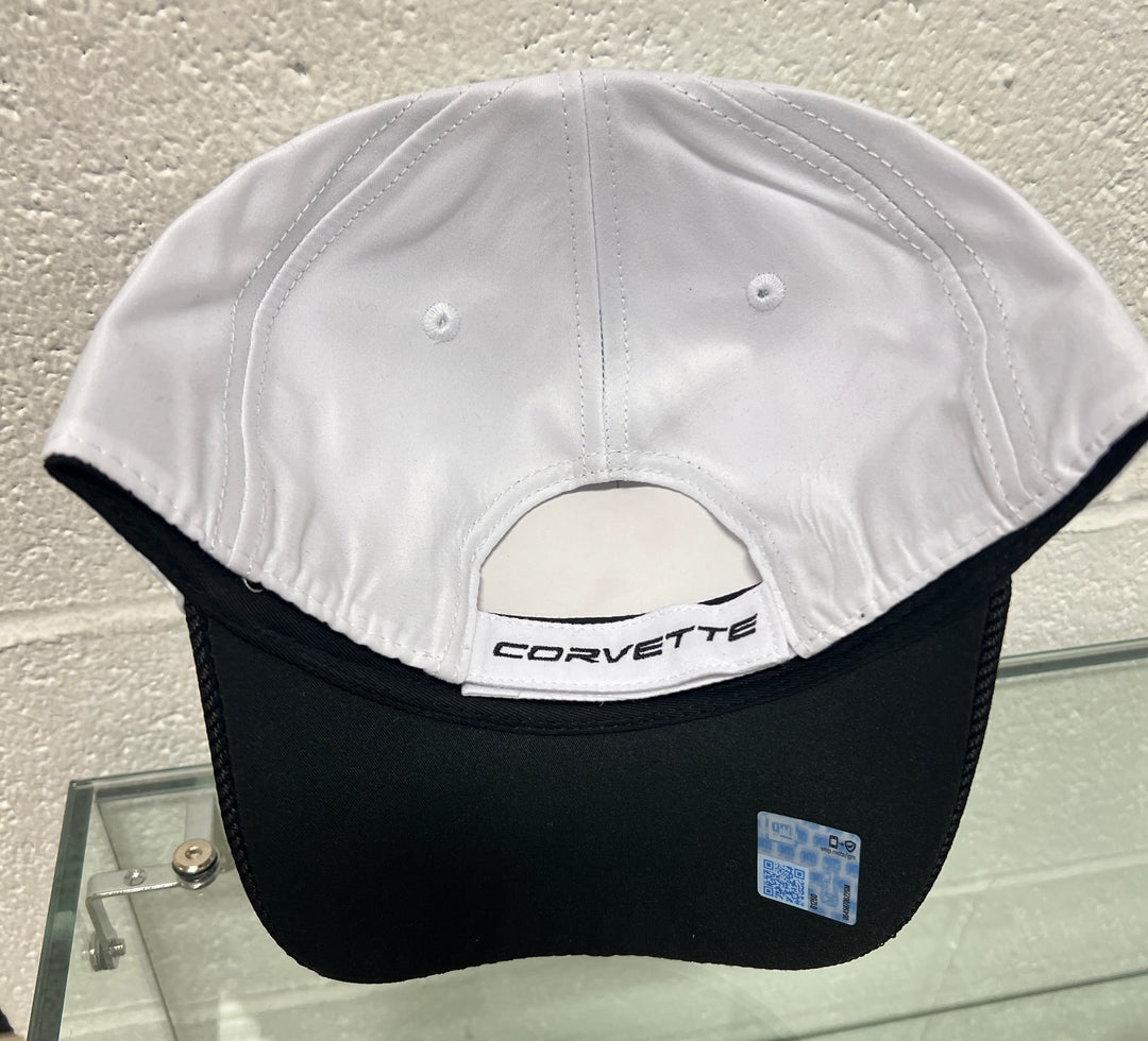 Black and white cap with Corvette logo on a textured surface
