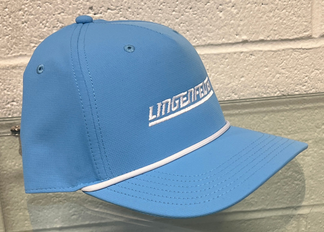 Blue cap with 'Lingenfelter' branding on a textured wall background