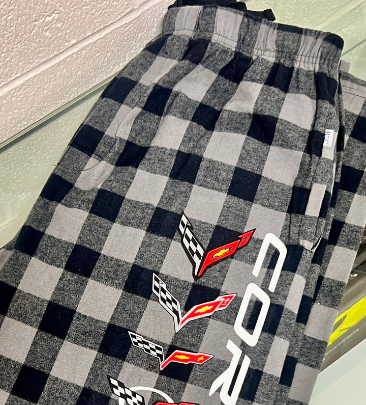 Plaid pants with Corvette logos on a checkered pattern