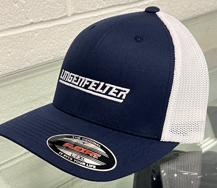 Navy and white cap with 'Lingenfelter' logo on a reflective surface.