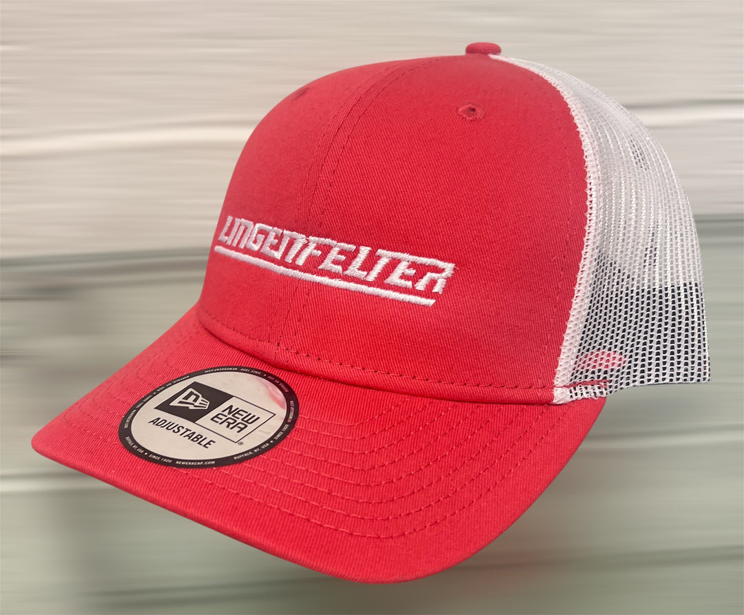 Red and white cap with 'Lingenfelter' branding on a metallic surface