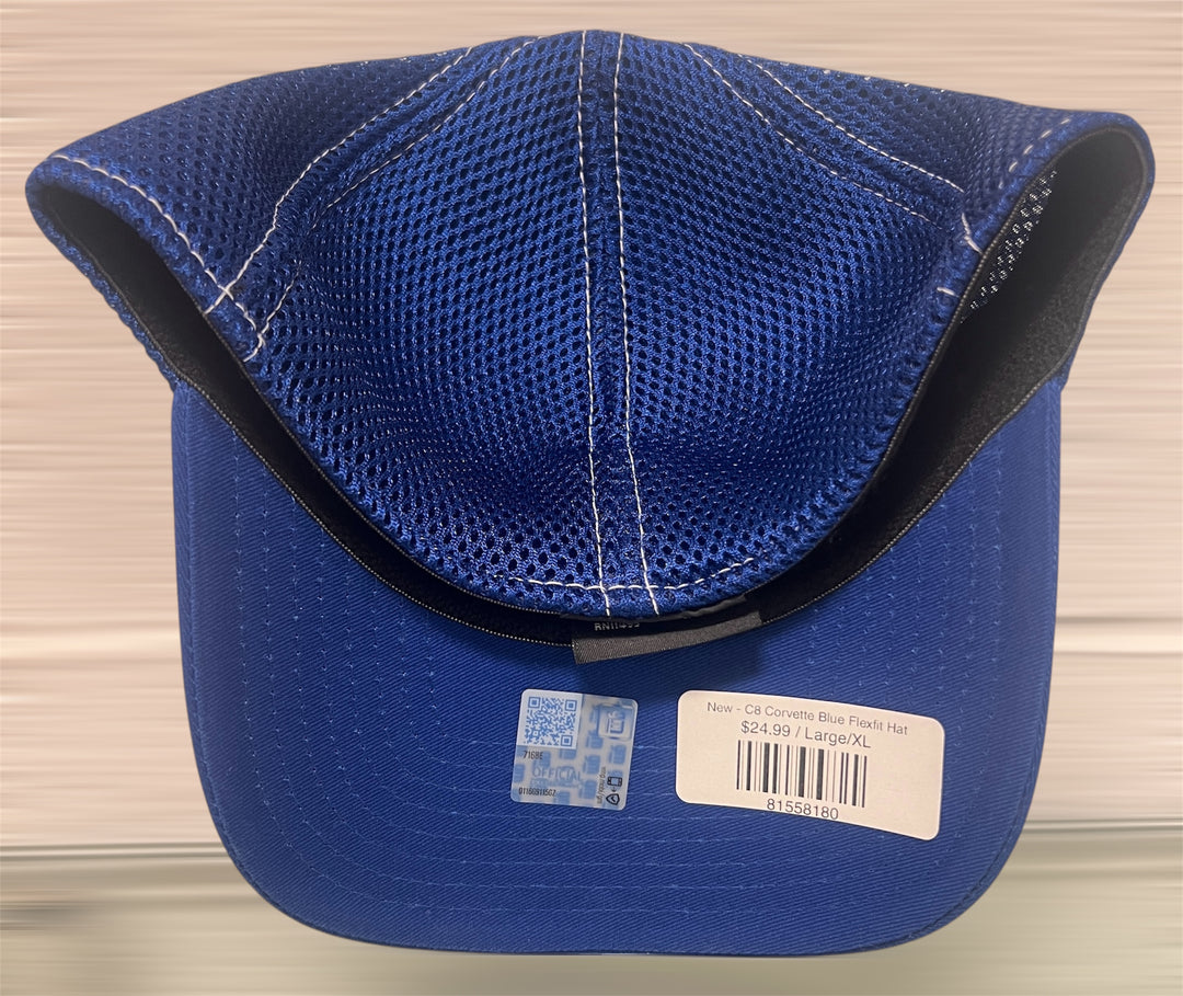 Blue cap with a brand label on a neutral background