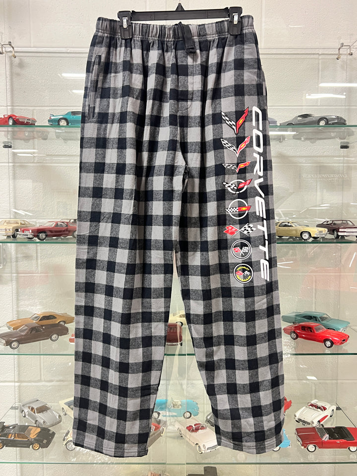 Black and white checkered fabric with Corvette logo and car graphics on a stand.