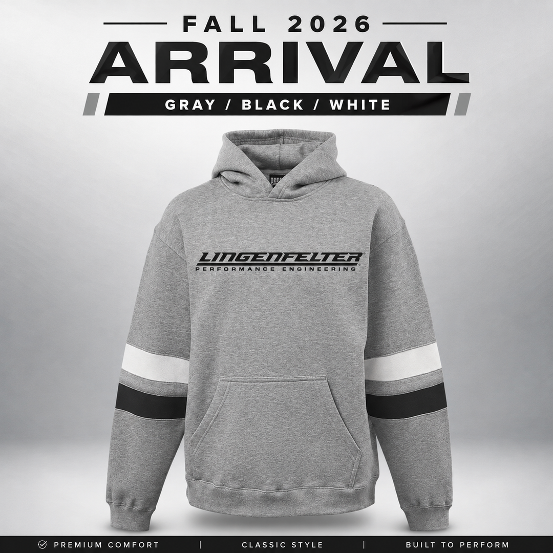 A gray pullover hoodie with black and white sleeve stripes and a black Lingenfelter Performance Engineering logo on the chest, shown against a light gray gradient background with 'FALL 2026 ARRIVAL' text above.