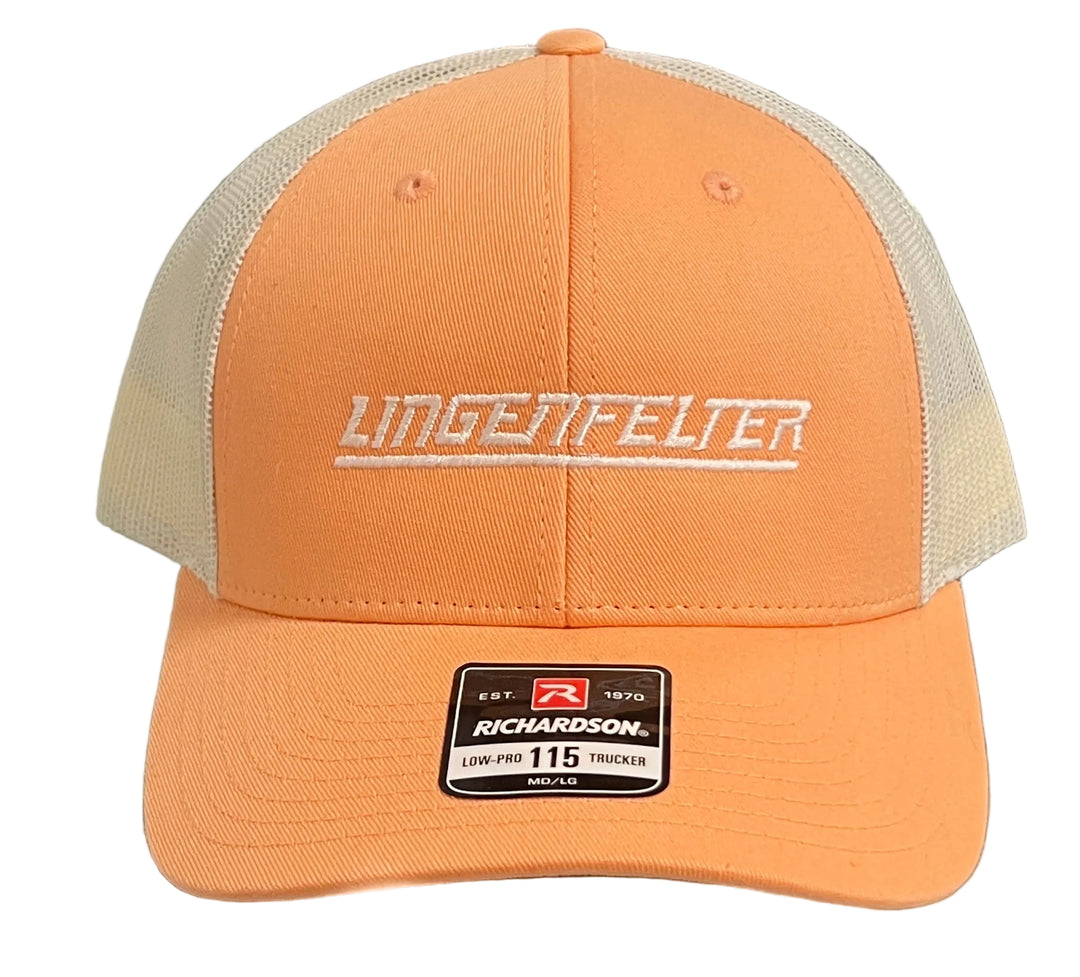 An orange Richardson 115 trucker hat with white mesh back panels and white embroidered 'LINGTFELTER' text on the front, displayed on a glass surface.