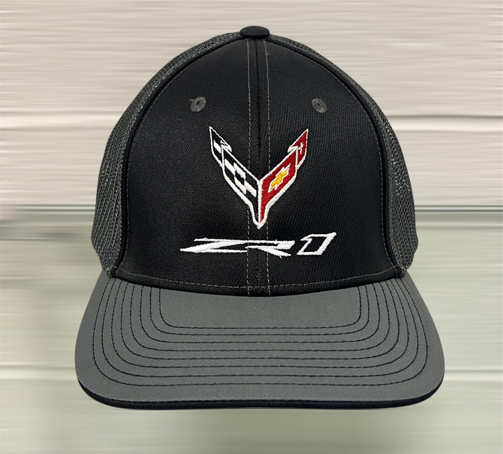 Black and graphite ZR1 Corvette Flexfit trucker hat by Team Lingenfelter, featuring embroidered Corvette logo and mesh back.