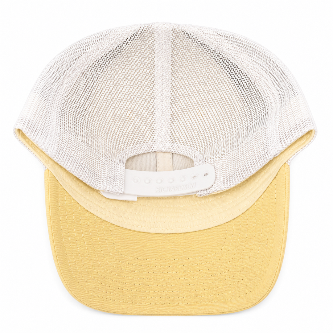 trucker style back of hat.  plastic snap.  pale yellow, mesh