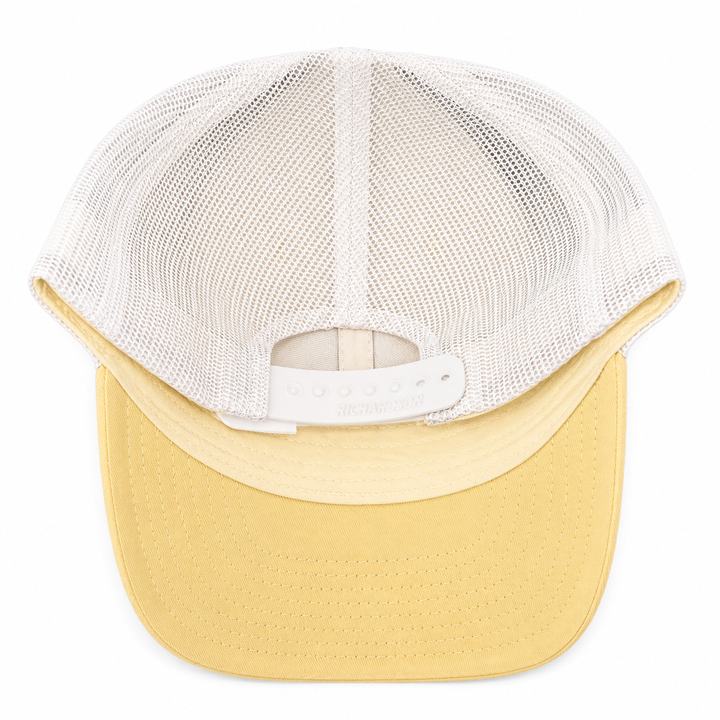 trucker style back of hat.  plastic snap.  pale yellow, mesh