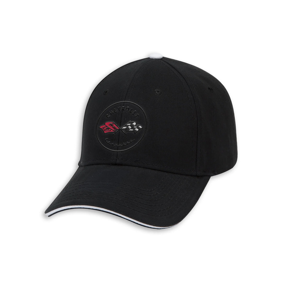 A black baseball cap featuring a circular embroidered Corvette C1 emblem on the front panel, with a white tip on the crown and a white stitched accent line along the edge of the curved brim.