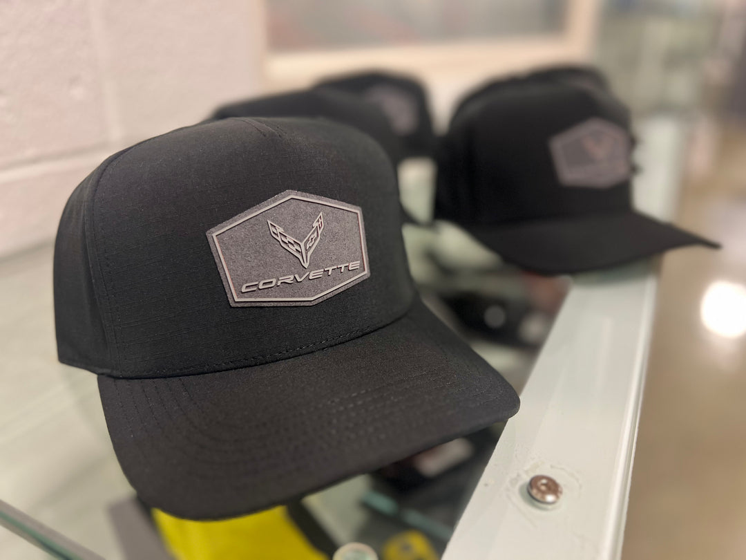 Black C8 Corvette hat with patch by Team Lingenfelter, featuring the Corvette logo and GM licensing details.