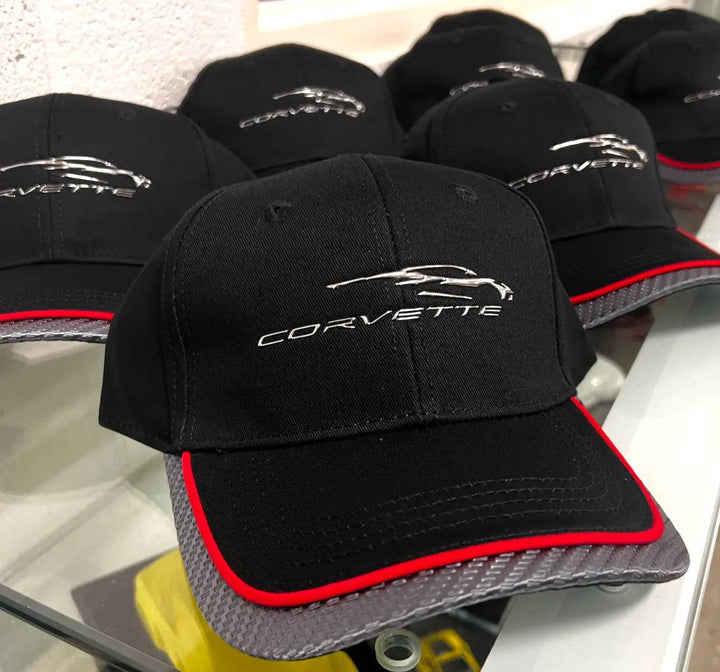 Red-trim C8 Corvette hat with carbon fiber accents, stylish baseball cap featuring Corvette branding and sporty design.