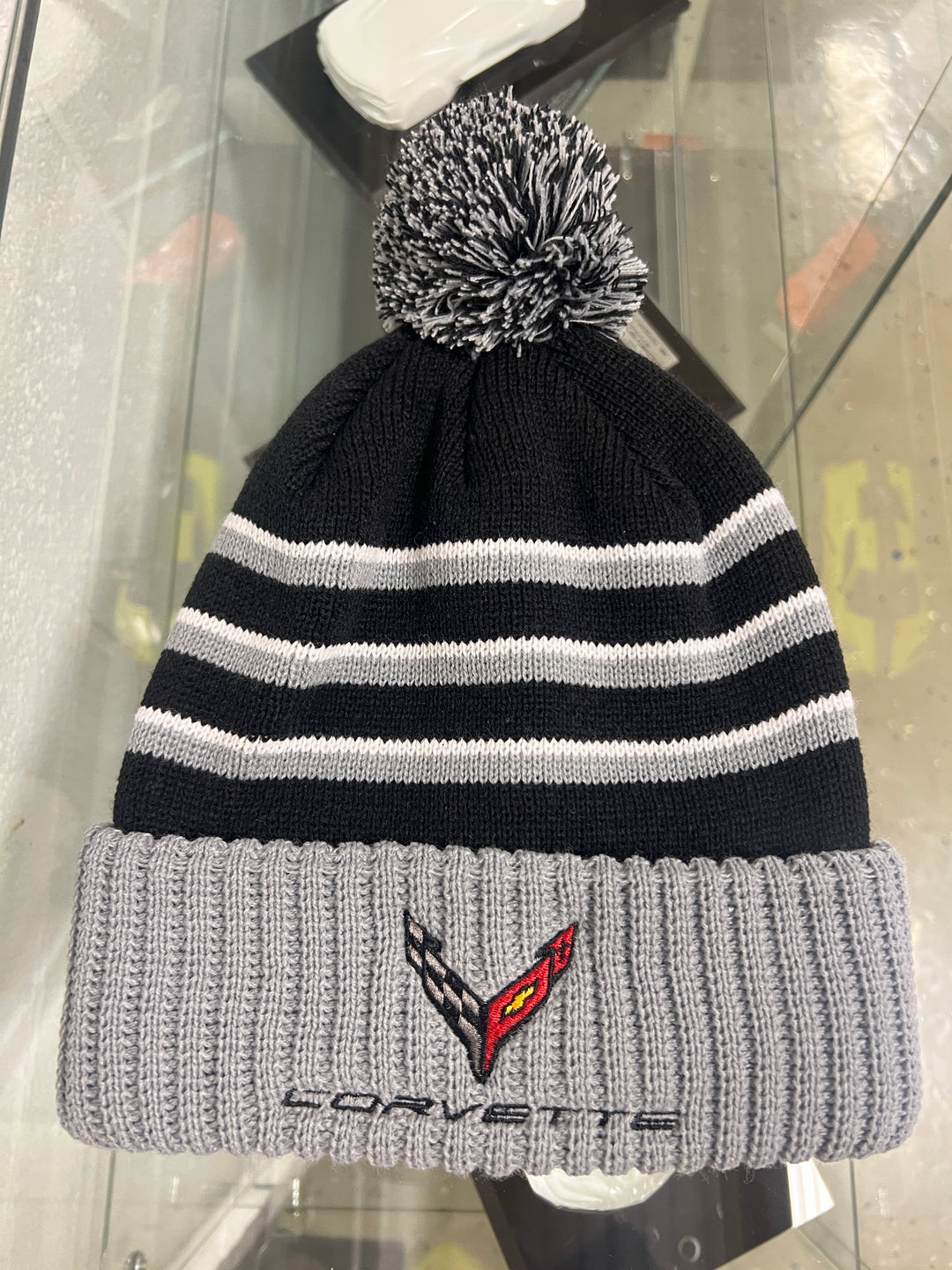 Gray and black C8 Corvette knit beanie with a pom by Lingenfelter Race Gear, featuring embroidered Corvette logo and racing style.