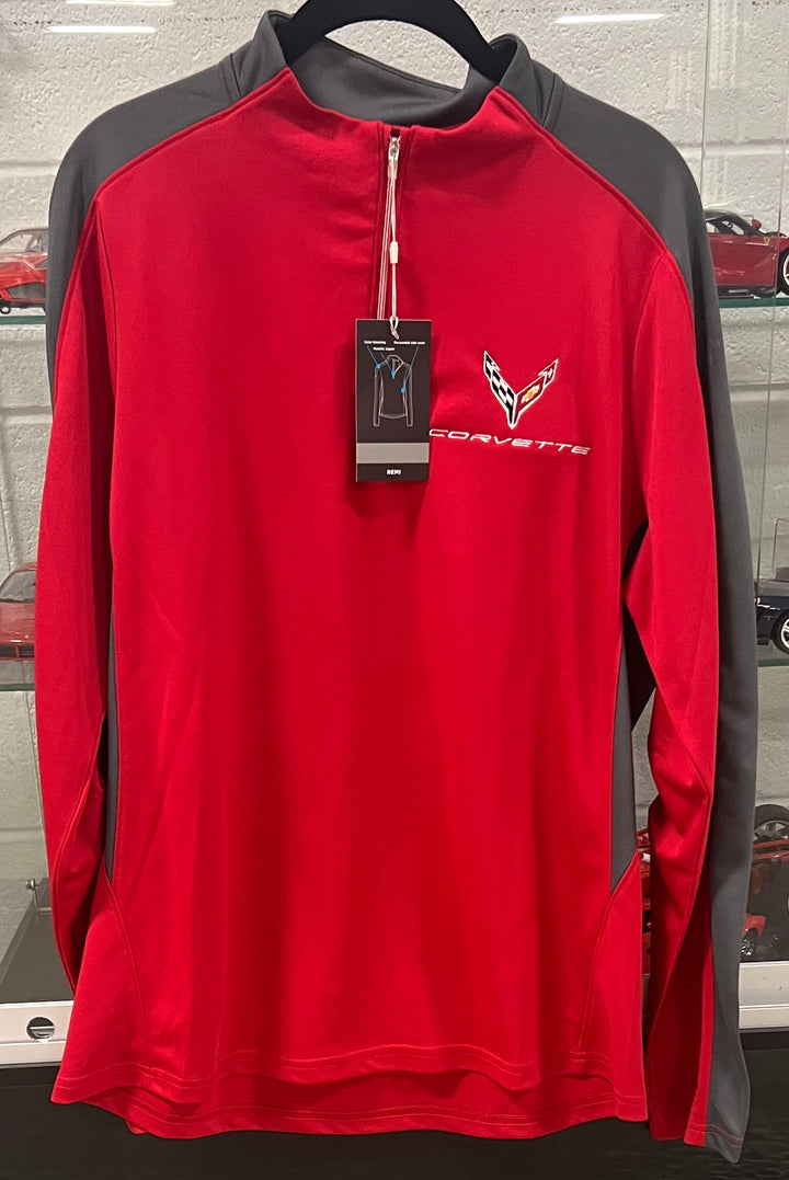 A red and gray long-sleeve quarter-zip athletic pullover with a Corvette logo on the left chest, hanging on a black hanger with a product tag attached.