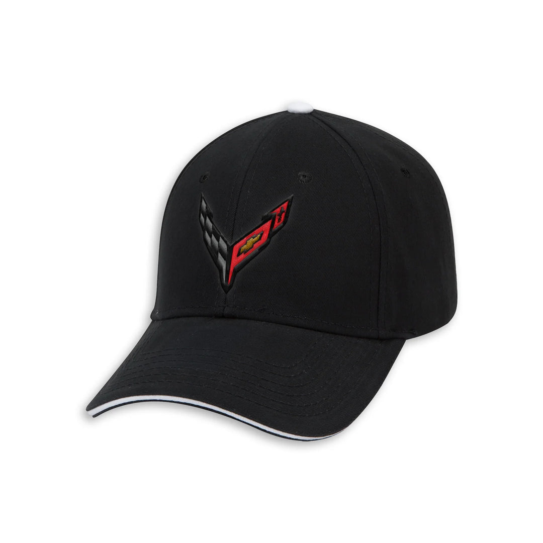 A black baseball cap featuring a red and black embroidered Corvette C8 logo on the front, with a white tip on the crown and a white stripe along the edge of the curved brim, set against a plain white background.