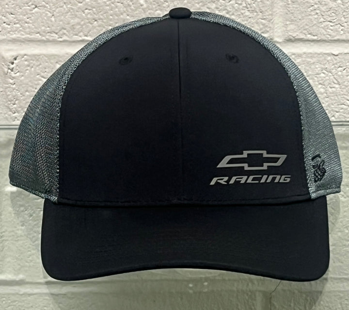 A black and gray trucker hat featuring a black front panel and visor, with gray mesh side and back panels. The front panel displays a silver Chevrolet logo with 'RACING' text underneath.