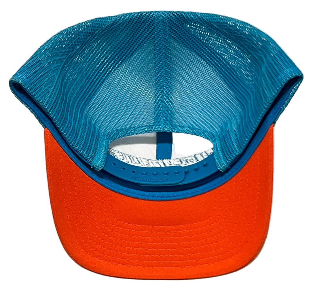 A two-tone trucker cap shown from the back, featuring a bright orange visor and a blue mesh back with a blue fabric trim.