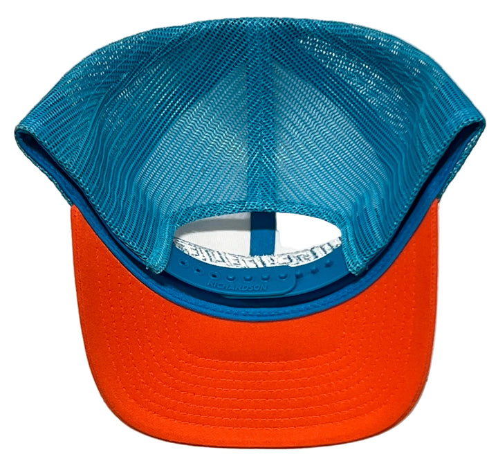 A two-tone trucker cap shown from the back, featuring a bright orange visor and a blue mesh back with a blue fabric trim.