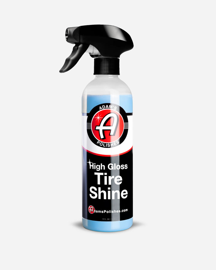 Spray bottle of Adam's Polishes High Gloss Tire Shine on a white background