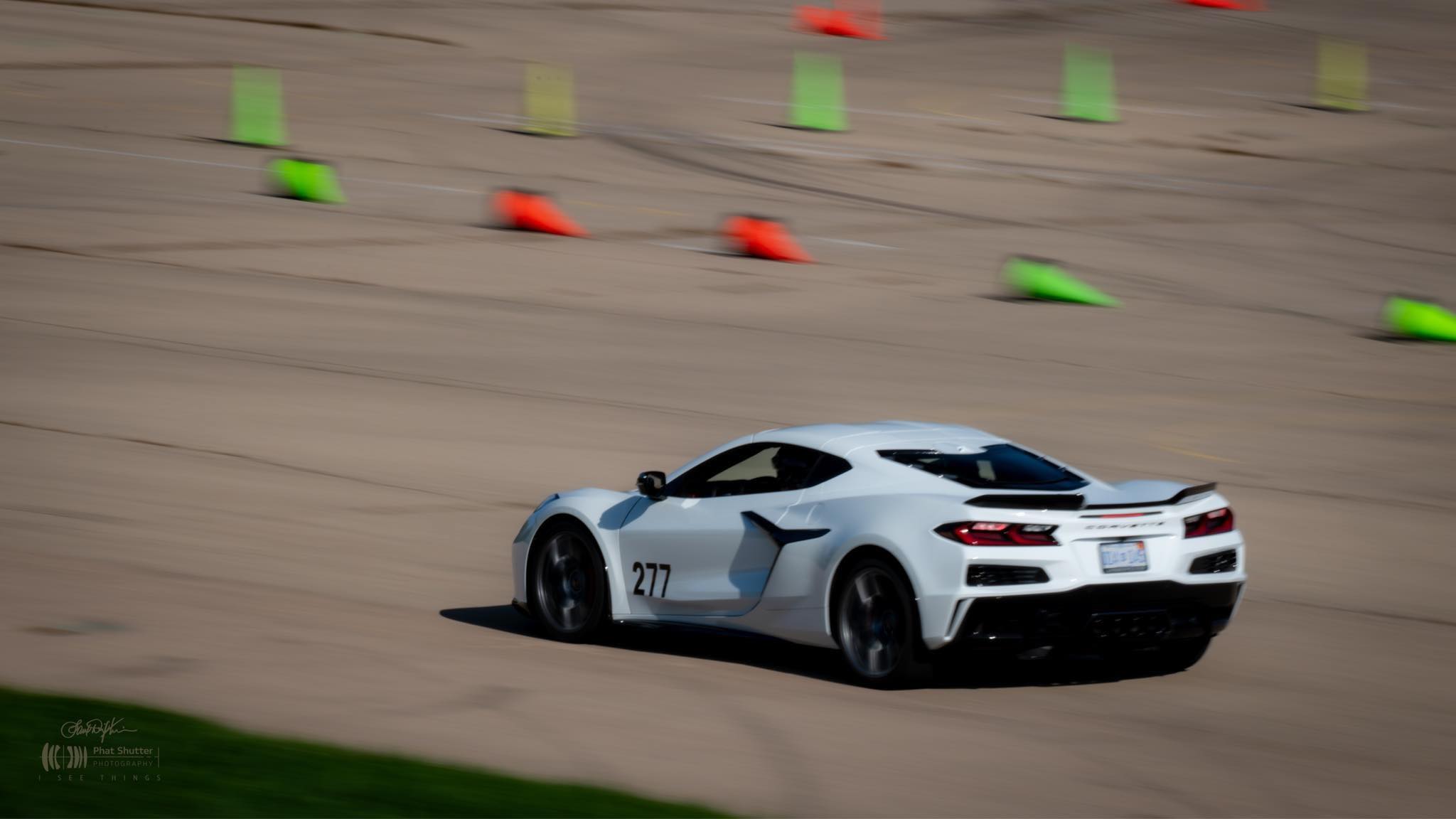 Kristen Lingenfelter C8 Corvette on race track Corvette apparel