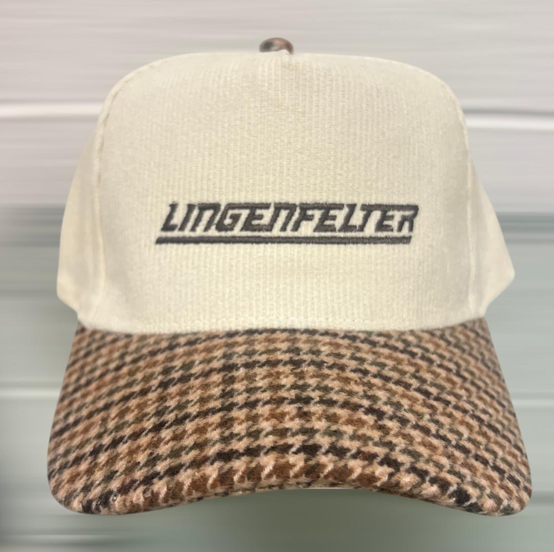 Cap with houndstooth pattern brim and 'Lingenfelter' logo on a neutral background