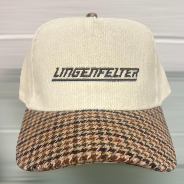 Cap with houndstooth pattern brim and 'Lingenfelter' logo on a neutral background