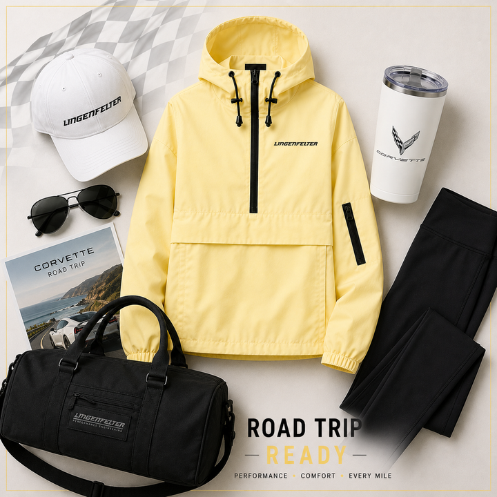Yellow jacket with black accents, black duffel bag, sunglasses, white cap, and tumbler on a light background.
